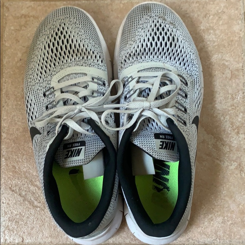 Grey, white, and black nike running shoes